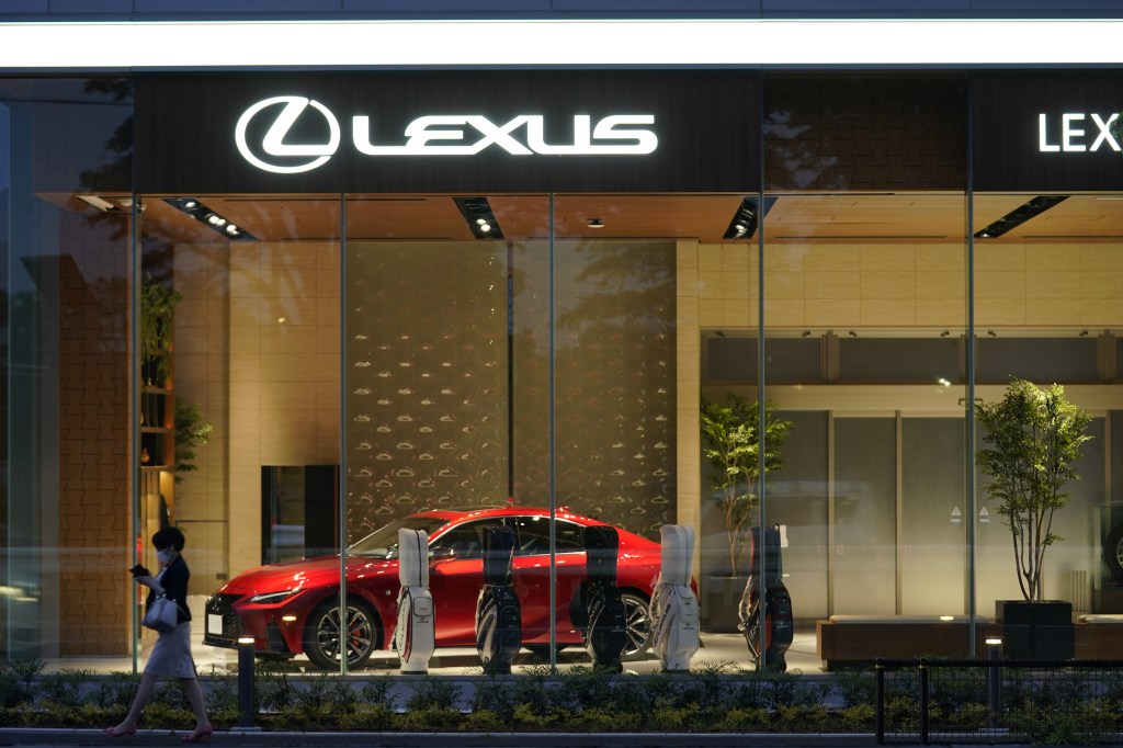 A red Toyota Motor Corp. Lexus IS300 sedan at a Lexus dealership in Tokyo, Japan