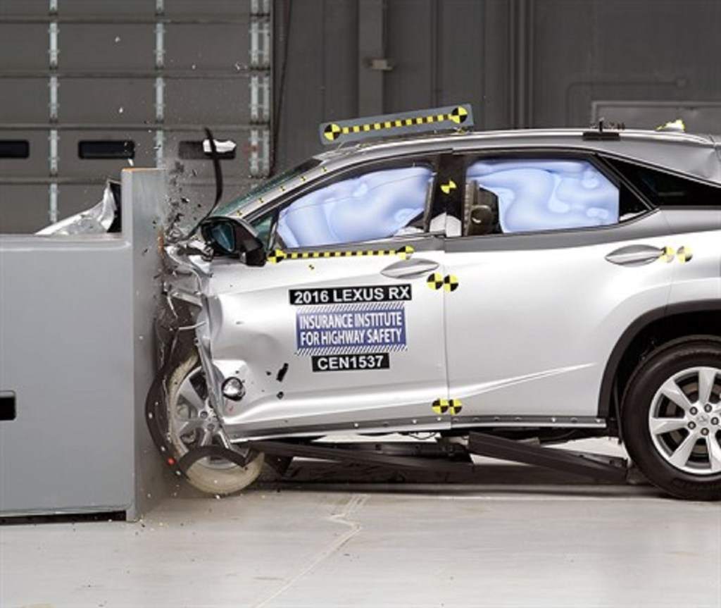 A silver Lexus RX is being crash tested.