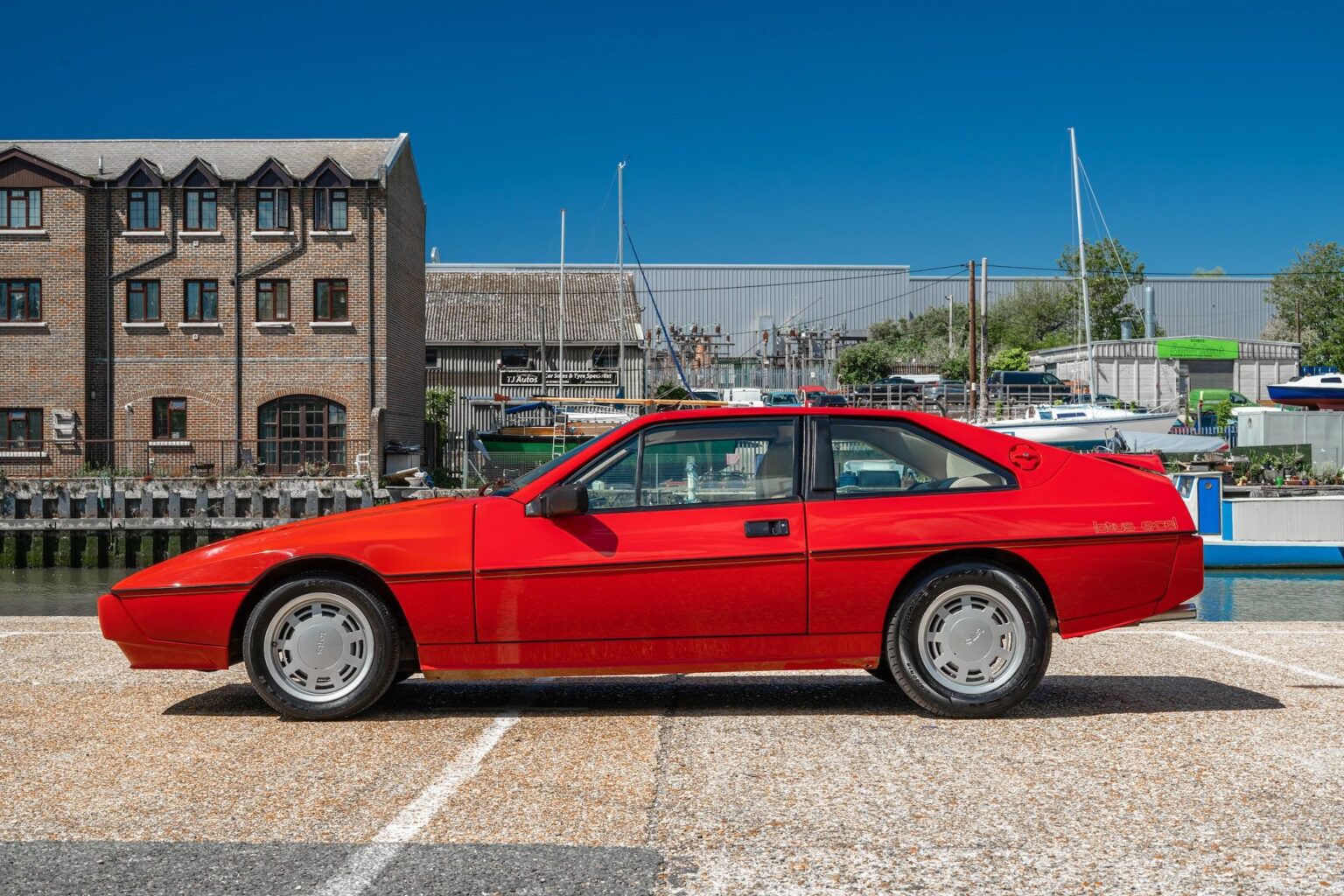 a red Lotus Excel from 1984. These are an obscure vintage European sports car