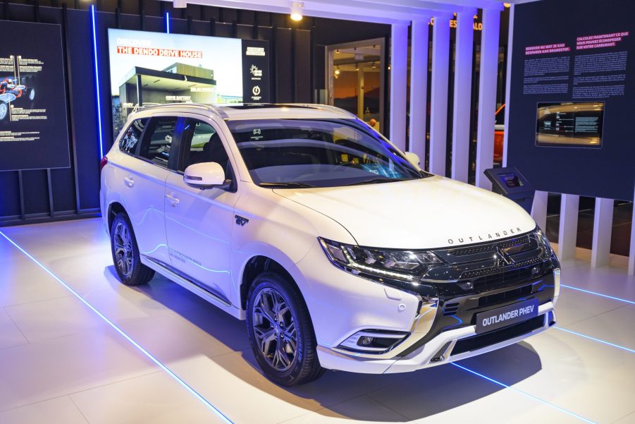 White Mitsubishi Outlander PHEV crossover plug-in hybrid SUV on display at Brussels Expo