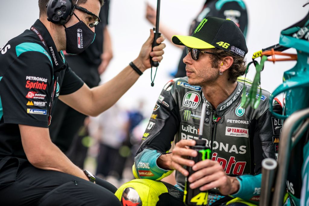 MotoGP racer Valentino Rossi speaks with his Petronas mechanic at the 2021 German Grand Prix