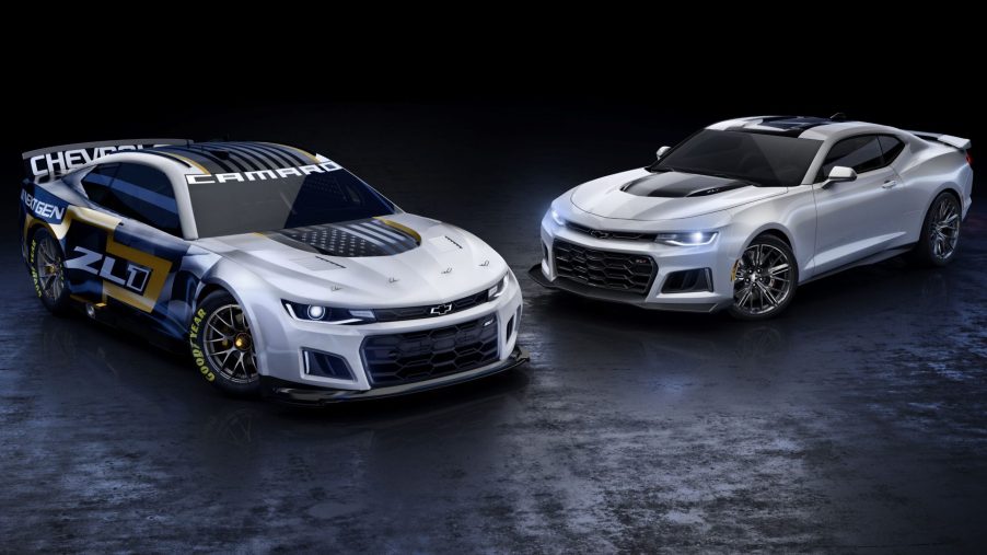 The silver-black-and-gold NASCAR Next Gen Chevrolet Camaro ZL1 next to a silver road-going 2021 Chevrolet Camaro ZL1