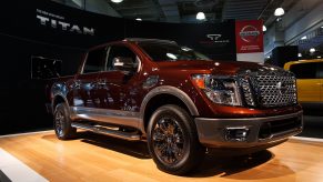 A maroon Nissan Titan pickup truck
