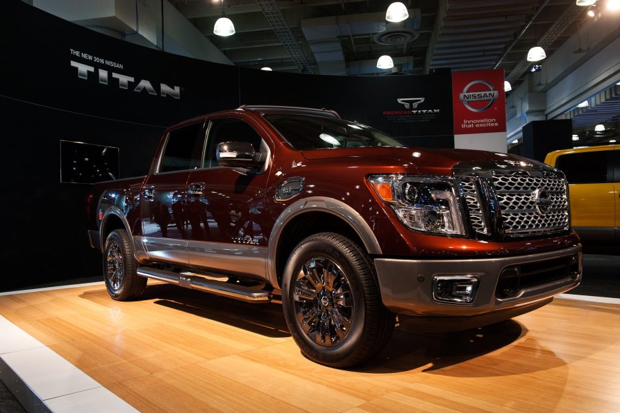 A maroon Nissan Titan pickup truck