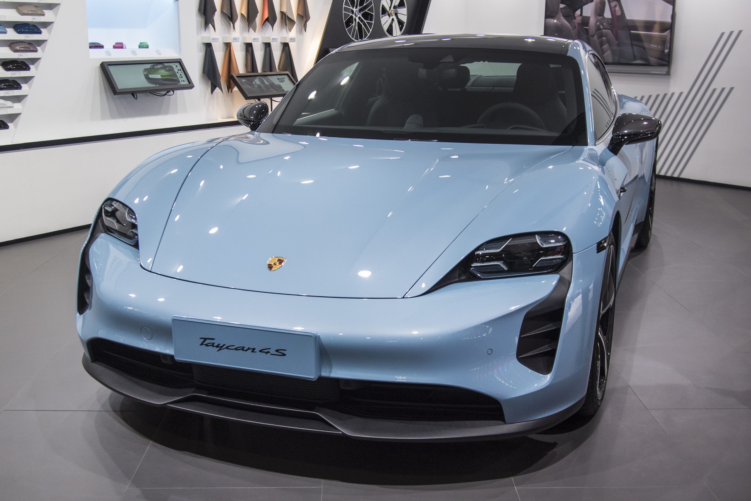 A blue Porsche Taycan 4S vehicle is on display during the 18th Guangzhou International Automobile Exhibition at China Import and Export Fair Complex
