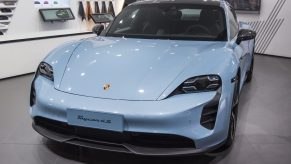A blue Porsche Taycan 4S vehicle is on display during the 18th Guangzhou International Automobile Exhibition at China Import and Export Fair Complex