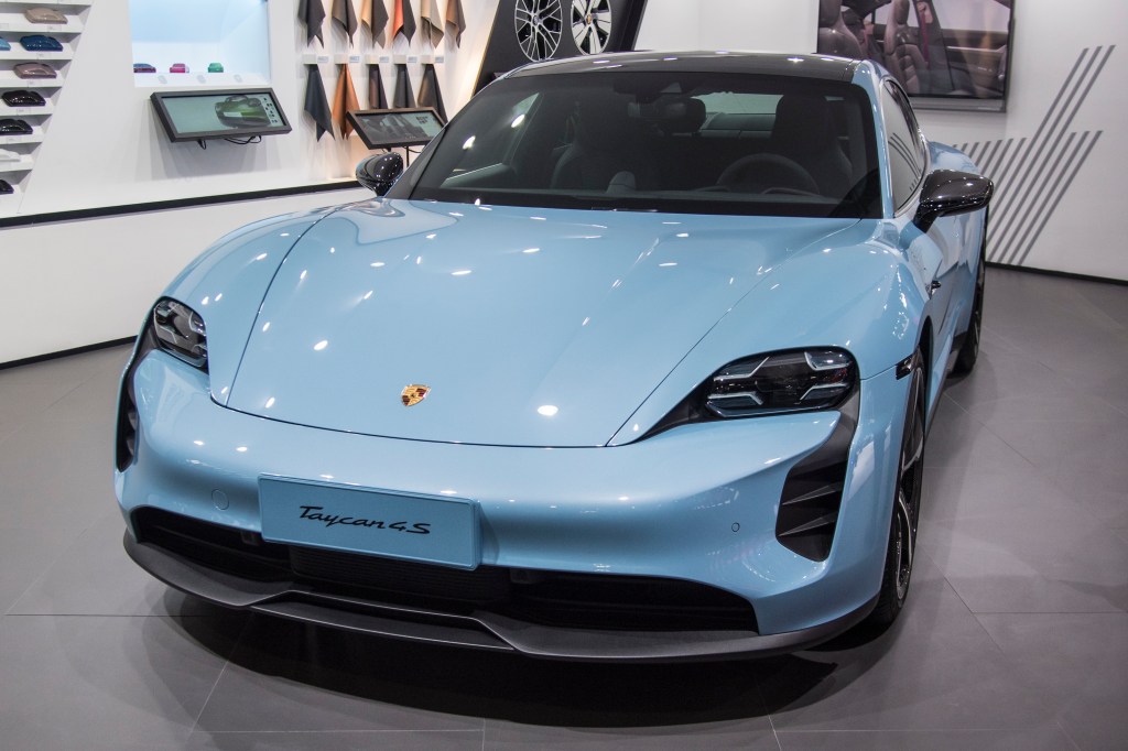 A blue Porsche Taycan 4S vehicle is on display during the 18th Guangzhou International Automobile Exhibition at China Import and Export Fair Complex