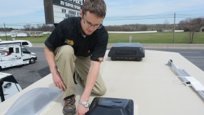 Checking RV Maintenance at Tom Schaeffer's RV Super Store, in Shoemakersville, with Aaron Bashore, service advisor. Check seals on roof vents and sky lights.