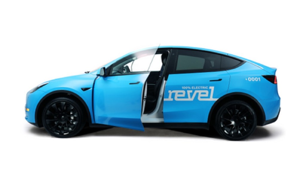 A blue Tesla Model Y with "revel" printed on the side.