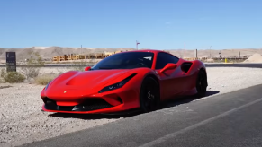 An image of a broken Ferrari F8 Tributo on the side of the road.
