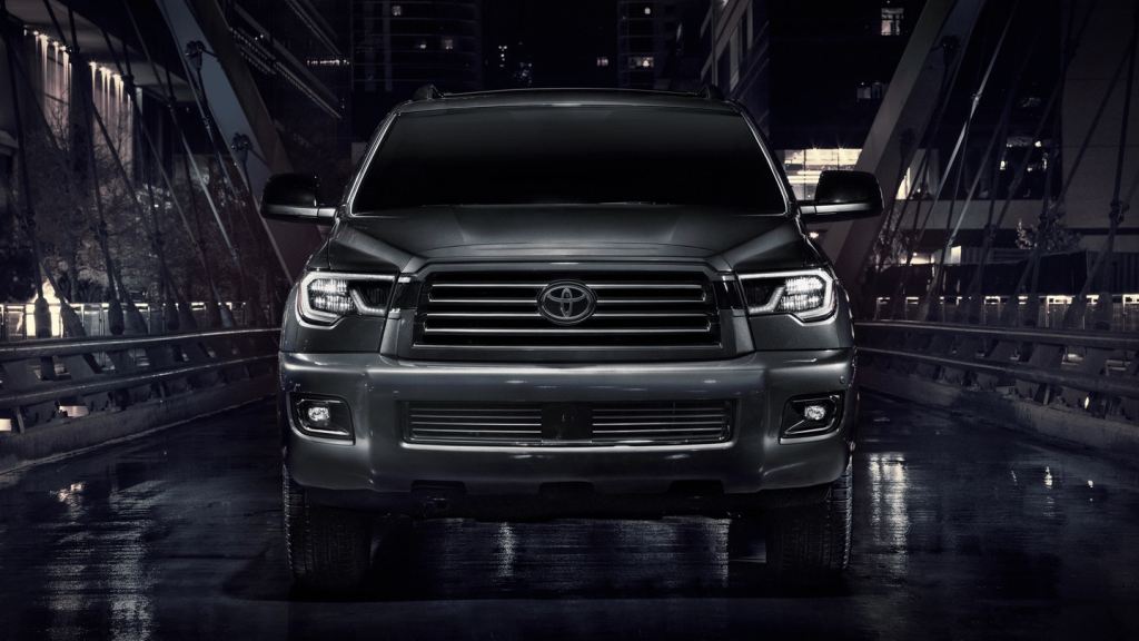 A black 2021 Toyota Sequoia against a black background.