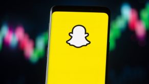 In this photo illustration a Snapchat logo seen displayed on a smartphone