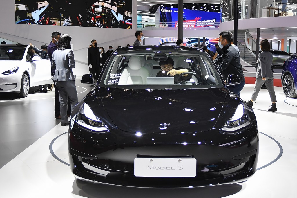A black Tesla Model 3 car is on displayed during the 19th Shanghai International Automobile Industry Exhibition