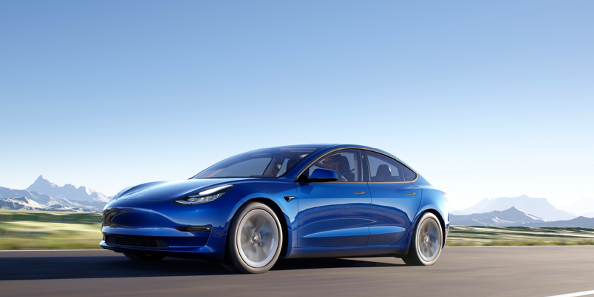 A blue Tesla Model 3 small electric sedan.