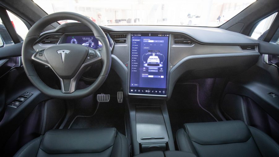 View into the interior with steering wheel and display of a Tesla Model X in the new Tesla Service Center