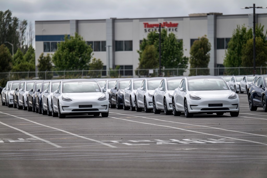 Tesla cars lined at the factory for deliveries