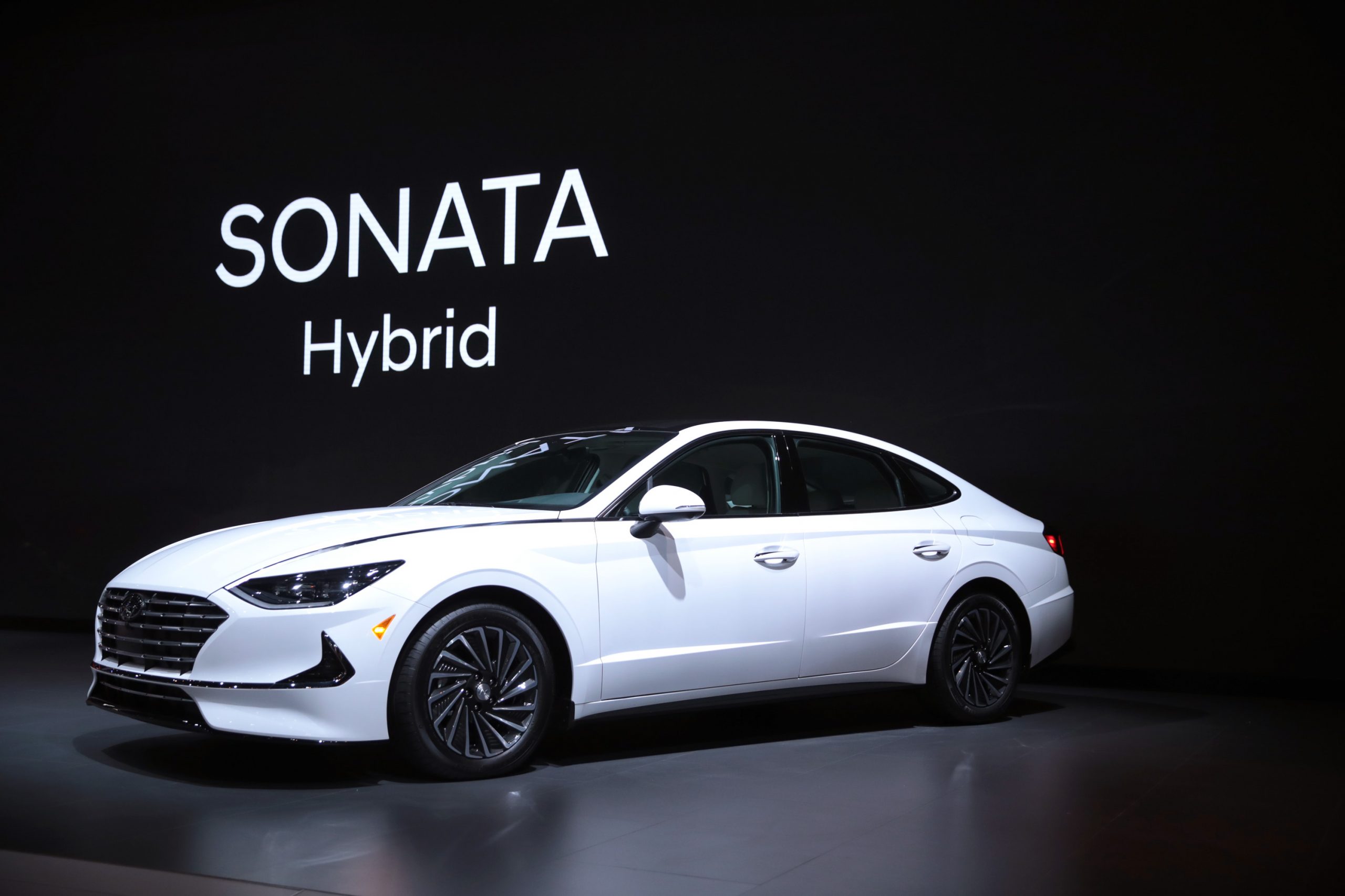 Hyundai shows off their white 2020 Hyundai Sonata Hybrid at the Chicago Auto Show