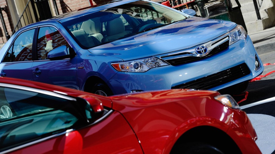 A blue and a red 2012 Toyota Camry sedan parked next to each other on August 23, 2011 in Hollywood, California