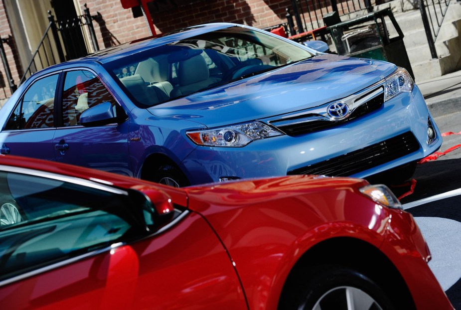 A blue and a red 2012 Toyota Camry sedan parked next to each other on August 23, 2011 in Hollywood, California