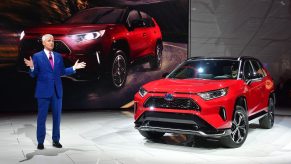 Toyota North America's Jack Hollis, group Vice president and general manager, introduces the red 2021 Toyota RAV4 Prime at the 2019 Los Angeles Auto Show