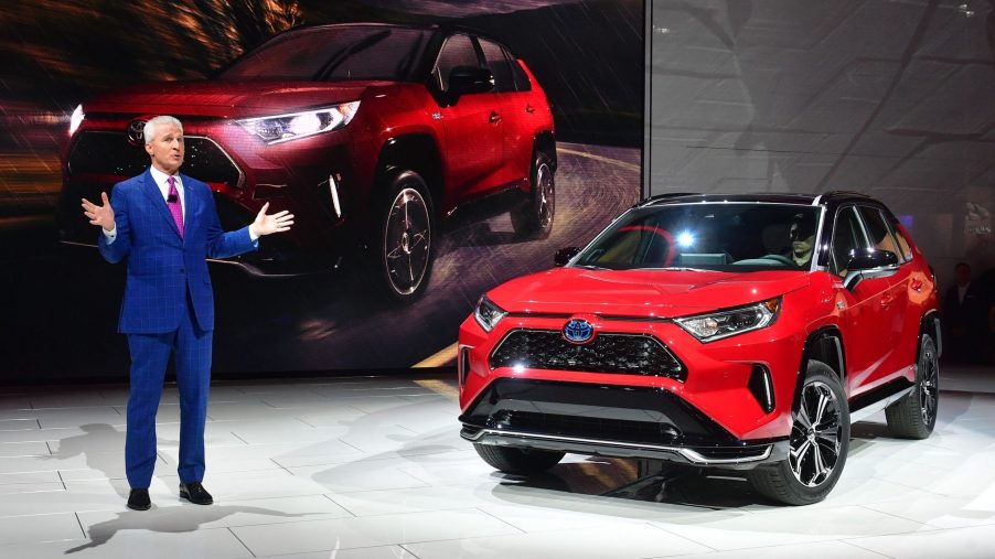 Toyota North America's Jack Hollis, group Vice president and general manager, introduces the red 2021 Toyota RAV4 Prime at the 2019 Los Angeles Auto Show