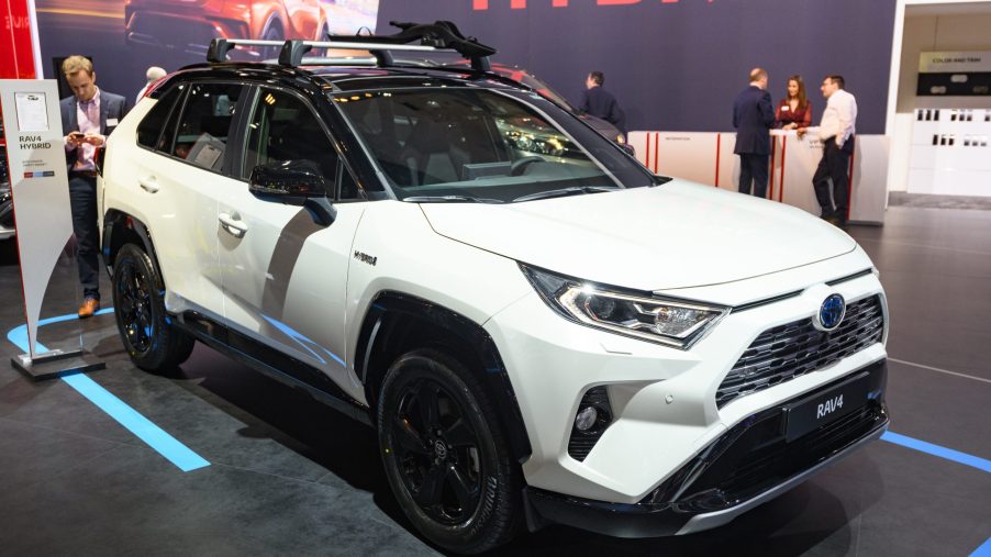 White Toyota RAV4 Hybrid compact SUV on display at Brussels Expo