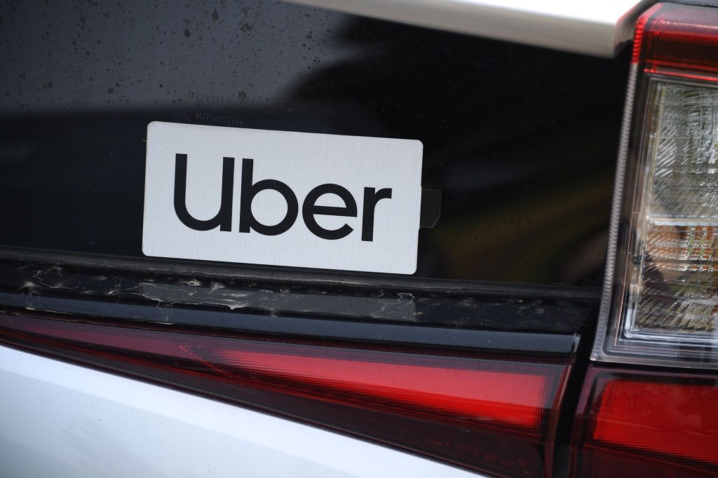 An Uber sticker on a white car on August 20, 2020, in Los Angeles, California