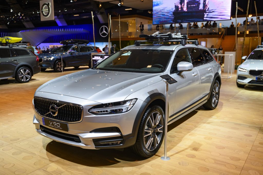 A silver Volvo V90 Cross Country at an auto show, the V90 Cross Country is one of the best luxury cars for tall drivers