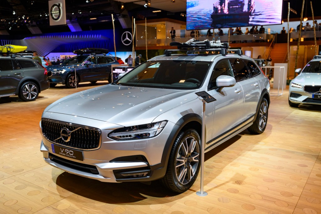 A silver Volvo V90 Cross Country at an auto show, the V90 Cross Country is one of the best luxury cars for tall drivers