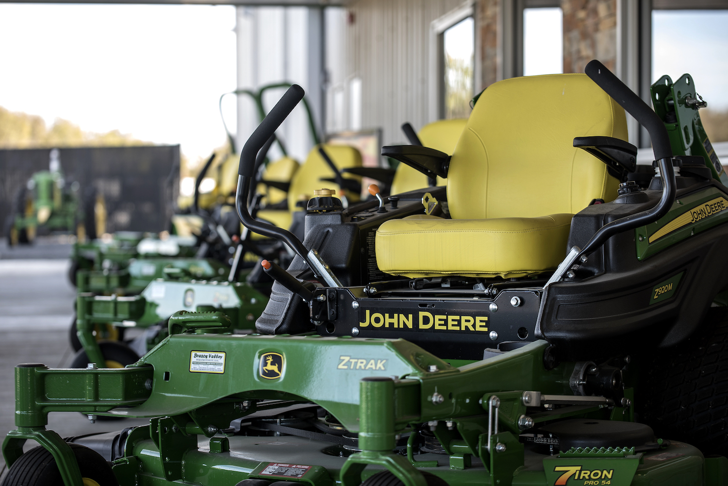 A zero-turn John Deere lawn mower, a zero-turn lawn mower is the best type of mower for large yards