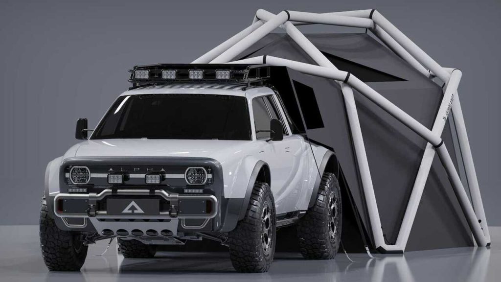A white Alpha Wolf+ Cloudbreak electric pickup truck with a geodesic tent
