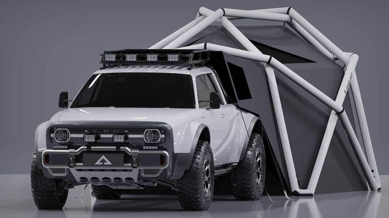 A white Alpha Wolf+ Cloudbreak electric pickup truck with a geodesic tent