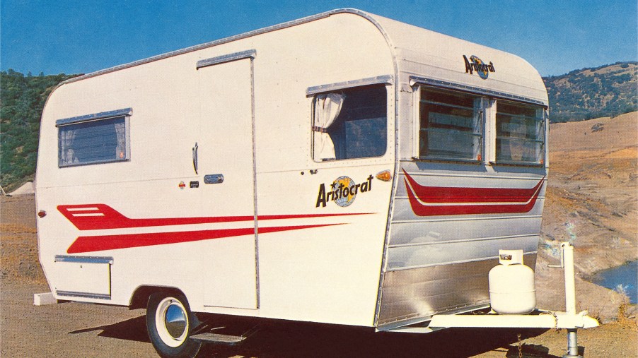 A vintage photo of a small Aristocrat travel trailer in the 1960s. This is not the camper that Lauren Nelson renovated.