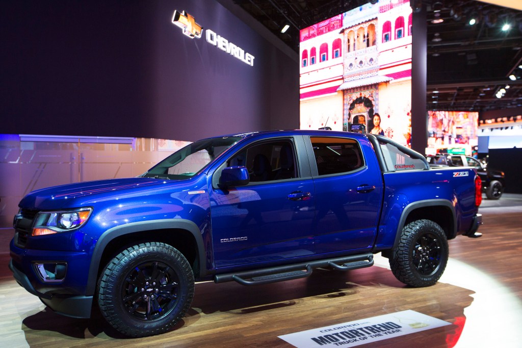 A blue Chevy Colorado pickup truck on display