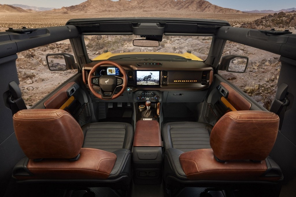 The Bronco interior with no roof or doors and a manual transmission