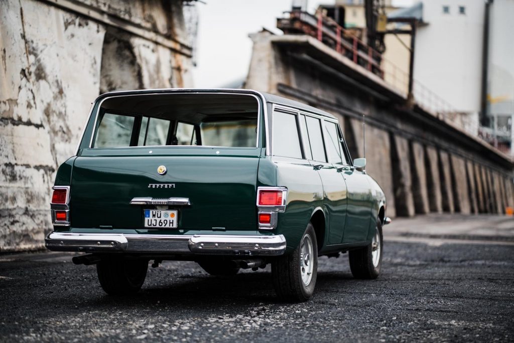 An image of a Jeep Grand Wagoneer with a Ferrari face called the "Jerrari" parked outdoors.