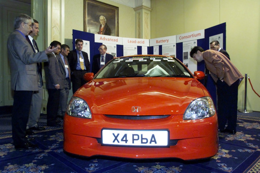 A first-generation Honda Insight at a show.