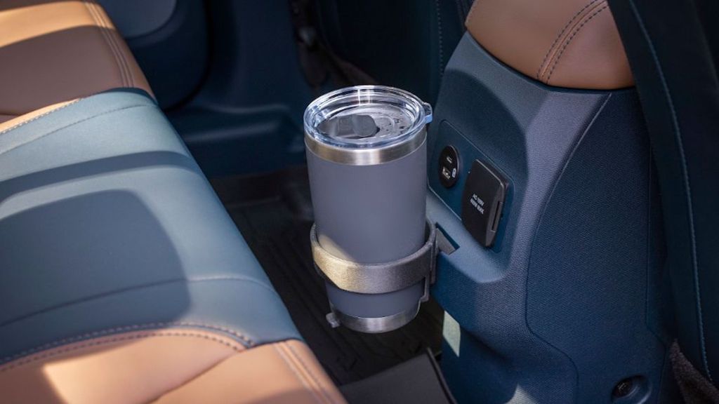 A cup holder attached to the FITS system in A Ford Maverick