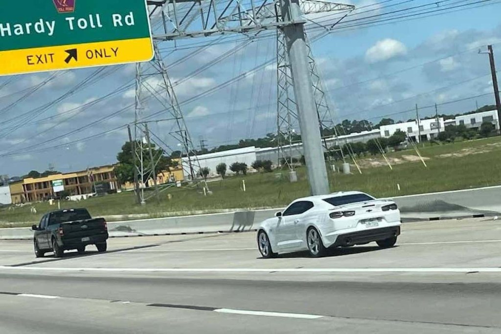 Texas police Camaro following a car on the highway