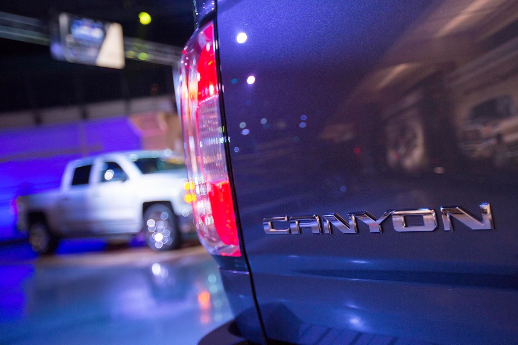The Canyon badge of a 2015 GMC Canyon pickup truck