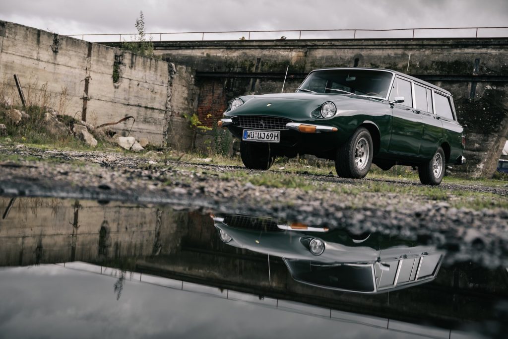 An image of a Jeep Grand Wagoneer with a Ferrari face called the "Jerrari" parked outdoors.