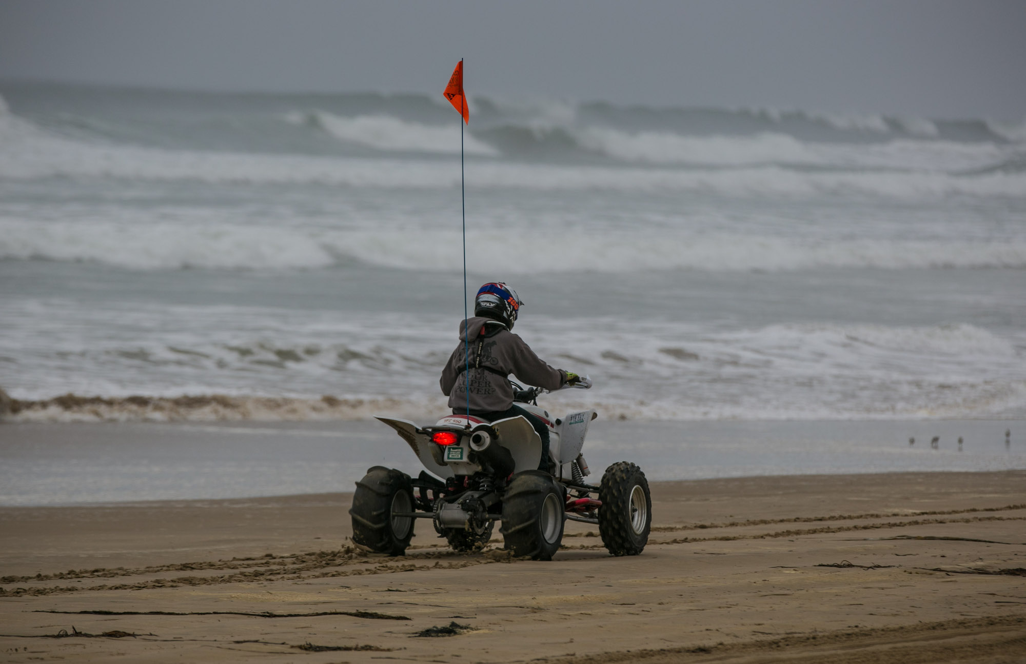 A boy rides an ATV on the sand in Oceano Dunes Preserve in California in November 2016