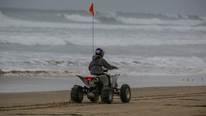A boy rides an ATV on the sand in Oceano Dunes Preserve in California in November 2016
