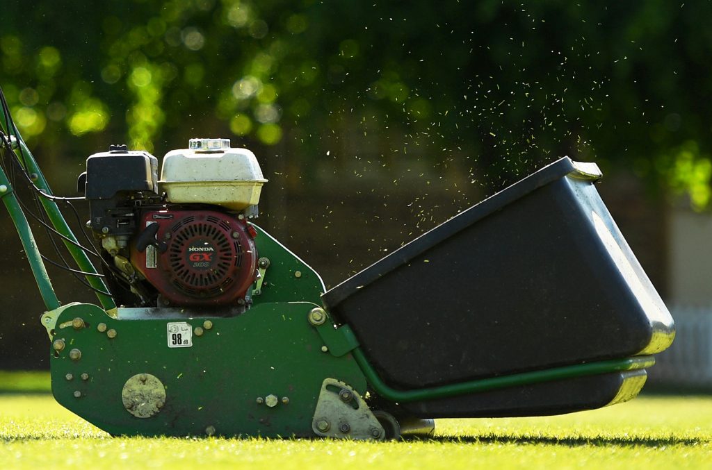 A detailed view of a green lawnmower