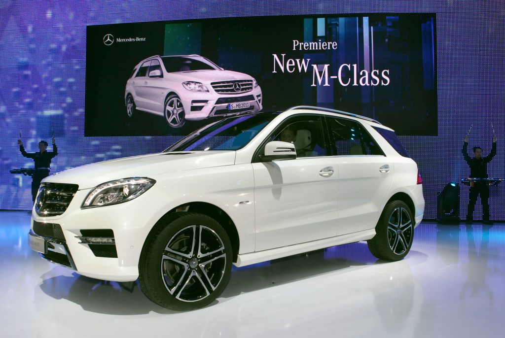 A white Mercedes M-Class SUV on display