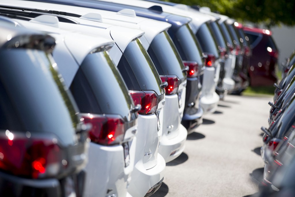 A row of 2017 Crysler Pacifica minivans displayed for sale at a car dealership in Moline, Illinois, in July 2017
