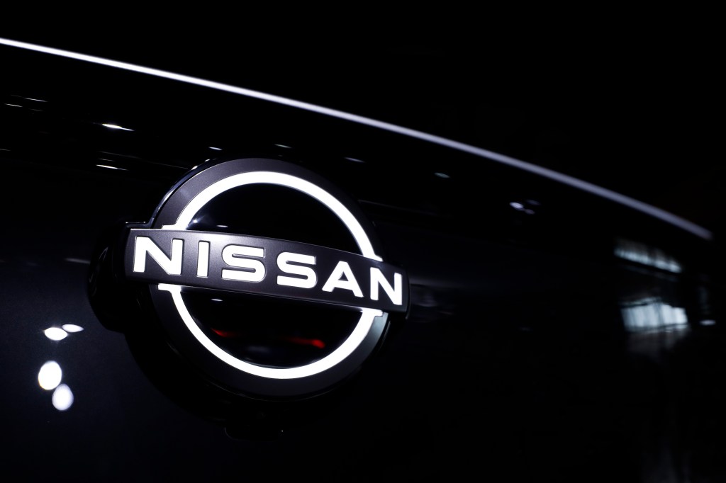 A backlit NIssan logo on a black grille