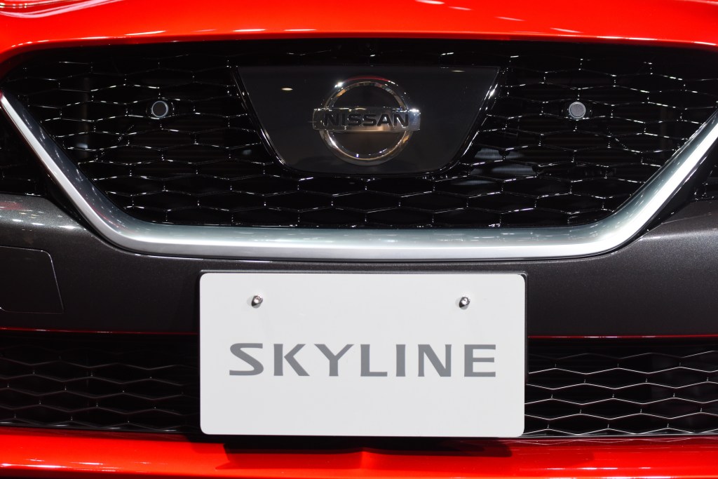 The grille of a red Nissan Skyline