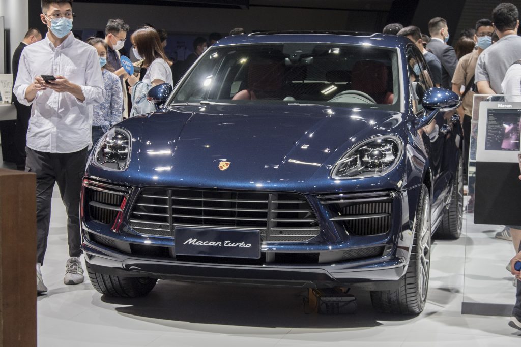 A blue Porsche Macan Turbo SUV on display