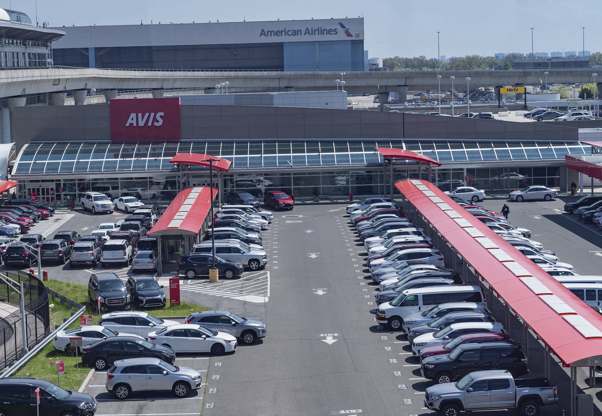 An Avis rental car parking lot is full because there were no customers during the COVID-19 pandemic at JFK Airport